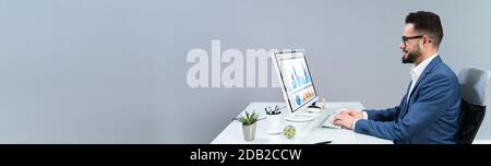 Business Analyst Man Working On Computer In The Office Stock Photo