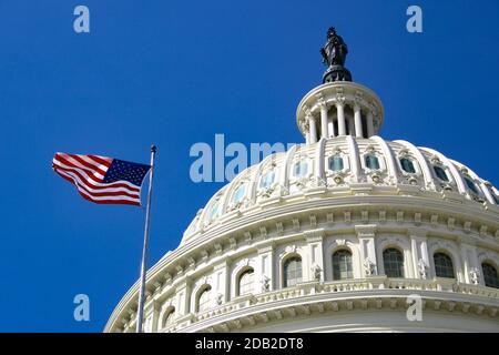 1 November 2020 Washington DC US - American flag in front of Capitol Hill in Washington DC with dome in daylight and facade details Stock Photo