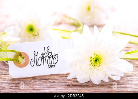 One Label WIth English Calligraphy Happy Mothers Day. White Spring Flower Blossom On Wooden Background Stock Photo
