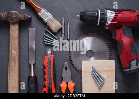 Different work construction tools for home renovation on table. Maintenance and reparing concept. Stock Photo