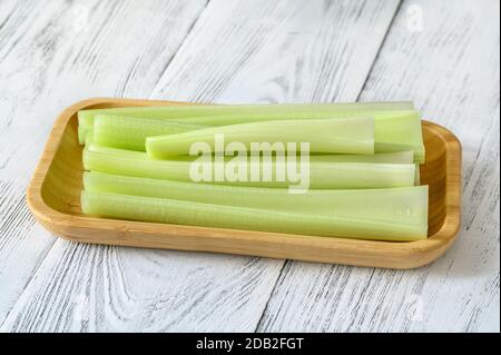 Fresh stalks of leaf celery on wooden bowl Stock Photo
