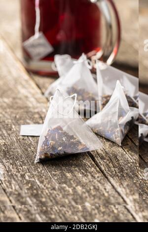 Floral tea bag on old wooden table. Stock Photo