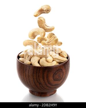 Falling cashew nuts isolated on white background Stock Photo