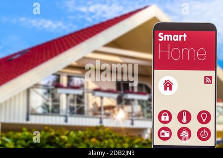 Mock Up of a Smart Hime App with Blurred Houes in Background Stock Photo