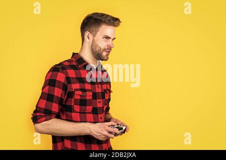 Premium Photo  Handsome man play with game console modern technology and  engineering video game console guy playing on console it is my hobby  inveterate gamer time for party fun