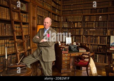 GREAT BRITAIN / England /Derbyshire/Ashbourne/ Tissington Hall / Sir Richard Ranulph FitzHerbert, 9th Baronet, in his library at Tissington Hall Stock Photo