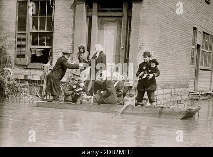 Rescue Work in Dayton Ohio; stranded victims lifted over to a small boat. Stock Photo