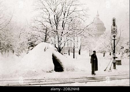 Man standing by snow hut, after blizzard of 1888, with U.S. Capitol in background, Washington, D.C.. Stock Photo