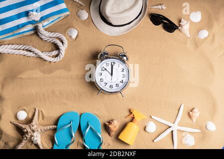 Alarm Clock In Sand On Sunny Tropical Beach Stock Photo
