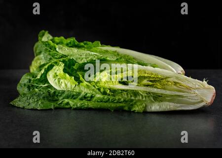 Lettuce Roman Lettuce on a dark background in a cut Stock Photo