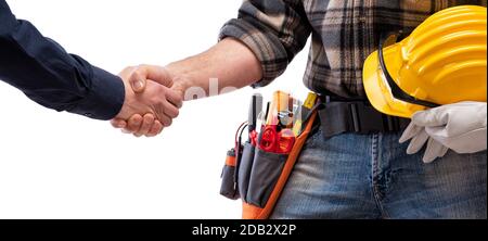 Close-up of a handshake of the electrician carpenter holding helmet and protective goggles in hand. Construction industry, electrical system. Isolated Stock Photo