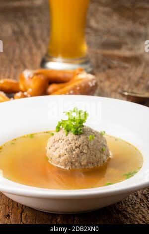 bavarian liver dumpling soup on wood Stock Photo