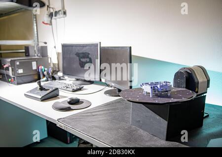 technically professional machine for 3D scanning and measurement of plastic moldings using a laser. Stock Photo