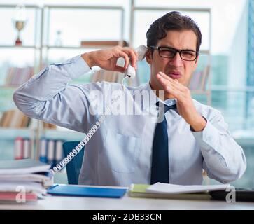 The businessman suffering from excessive armpit sweating Stock Photo