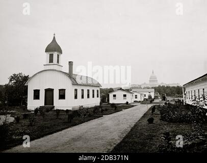 Washington, D.C. Chapel and other buildings of Armory Square Hospital, 6th and B [Independence Ave.] Sts. SW; completed U.S. Capitol in distance. Stock Photo