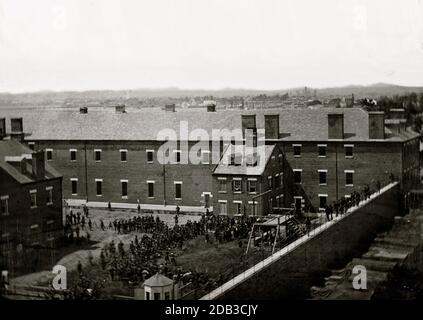 Washington, D.C. Execution of the conspirators: scaffold in use and crowd in the yard, seen from the roof of the Arsenal. Stock Photo