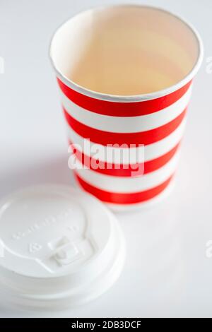 green paper cup with red plastic lid for takeaway drinks isolated on white  background. Container for coffee and tea Stock Photo - Alamy