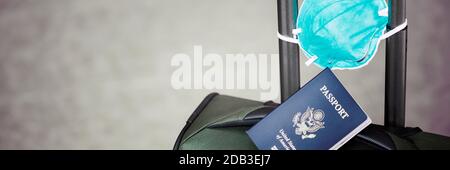 personal luggage with passport and flu virus mask to protect against coronavirus, global epidemic concept Stock Photo
