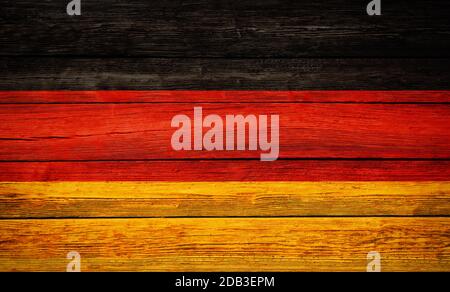 Germany national flag colors painted on old wooden plank background Stock Photo