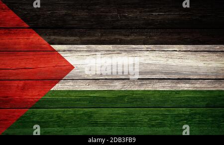 Palestine national flag colors painted on old wooden plank background Stock Photo