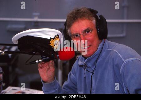 DJ Johnnie Walker at Ayr circa 1990. Outside broadcast on a Royal Navy Ship which was docked at the harbour Stock Photo