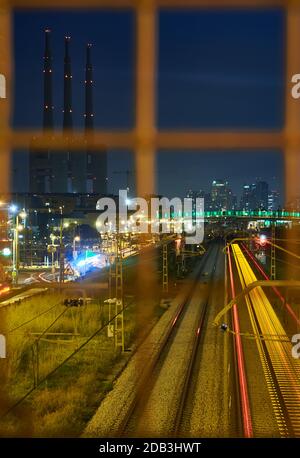 Railway network view with the FECSA towers and Barcelona dowtown in the background Stock Photo