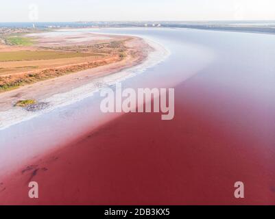 White Salt Shores of Red Kuyalnik Liman in Ukraine, Odessa at Summer Stock Photo