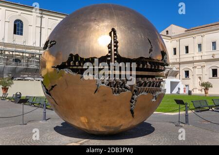 Vatican Museums, Sphere within a Sphere (Sfera con Sfera) bronze artwork by Arnaldo Pomodoro n the Courtyard of the Pinecone (Cortile della Pigna) Stock Photo