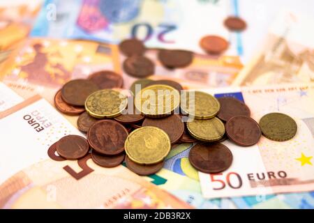 Different euro coins on twenty and fifty euro bills Stock Photo