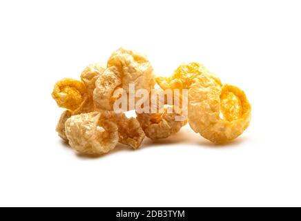 Pork snack crispy and blistered isolated on white background. Crispy pork skin pieces. Food concept. Stock Photo