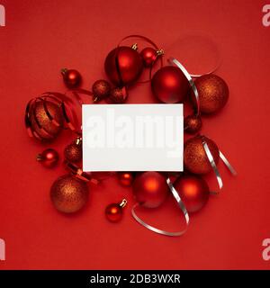 Nice composition of red christmas balls on red background Stock Photo