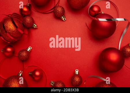 Nice composition of red christmas balls on red background Stock Photo