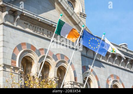 Irish, European and local flags flying outside the Town Hall at Dun Laoghaire in County Dublin, Ireland Stock Photo