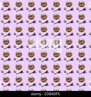 Seamless pattern with repeating Easter basket objects i eggs, quail egg and a bouquet of dry lavender on a purple background Stock Photo