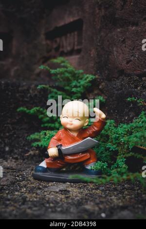 Cute superman superhero batman superman fantasy toy doll. Robotic alien fictional character adventure background. Part of series. Close up portrait. O Stock Photo