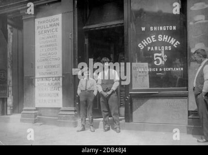 Young boy is Ciriakos Keiradimos, a young Greek shoe-shiner, working in shop at 511 Penn. Ave., N.W., Washington, D.C. Said to be 16 yrs. old, but is absolutely illiterate. Has been in this country only 2 months. Works until 9 P.M. every day and until 11 P.M. . Stock Photo