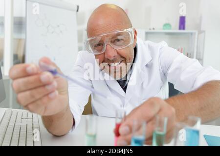 handsome senior doctor working in lab Stock Photo