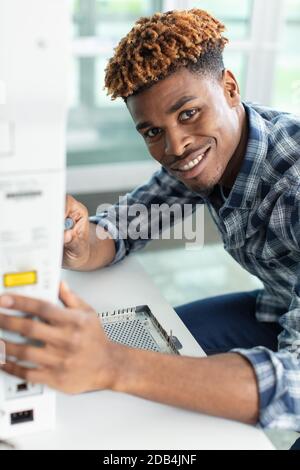 repairman working in technical support Stock Photo