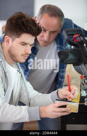 two wood designer working in workshop Stock Photo