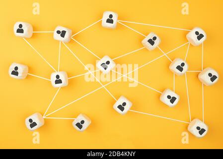 connections between people, social network concept with wooden blocks on colored background Stock Photo
