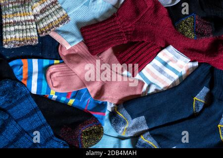 A Lot of various cotton socks and knitted woollen winter socks, top view. Stock Photo