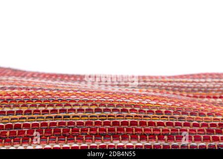 Close view texture of rug carpet in yellow, red and oranges tones. Stock Photo