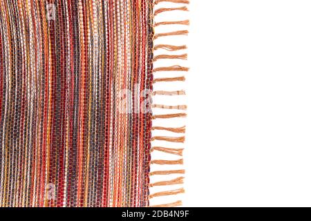 Close view texture of rug carpet in yellow, red and oranges tones. Stock Photo