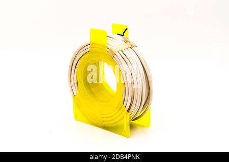 Small cable reel drum isolated on an isolated white background Stock Photo