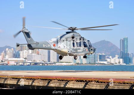Government Flying Service (政府飛行服務隊) helicopter (Airbus H175) lifting off at Wanchai helipad, Hong Kong, 2020 Stock Photo
