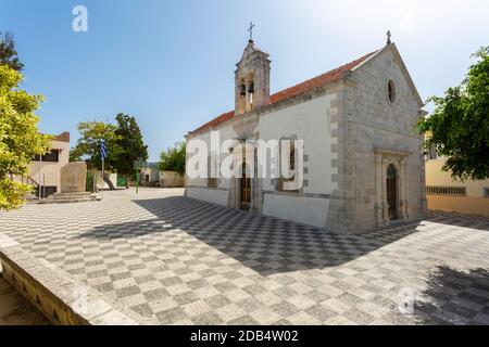 Eastern Orthodox Church and courtyard near Kamari Beach in Gerani, Rethymno Municipality, Crete, Greece Stock Photo