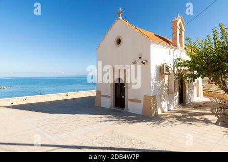 A seaside Eastern Orthodox Church near Kamari Beach in Gerani, Rethymno Municipality, Crete, Greece Stock Photo