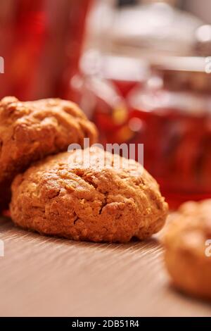 Hot aroma tea set teapot, cup of tea and little cookie on wooden table Stock Photo