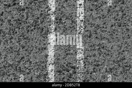 White stripes on the asphalt road. Top view. Background texture Stock Photo