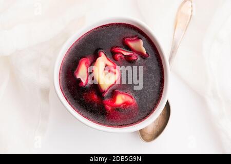 Christmas beetroot soup, borscht with small dumplings with mushroom filling Stock Photo